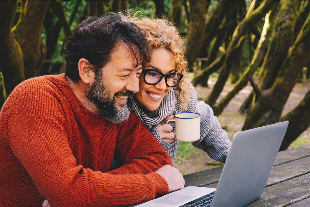 Couple learning about side hustles online Couple learning about side hustles online